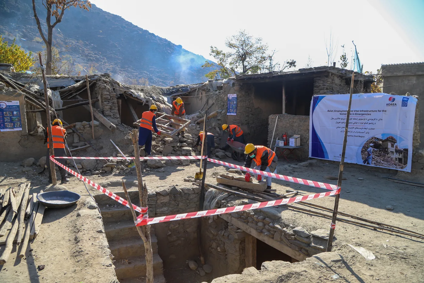 A marked work area surrounds earthquake debris clearance